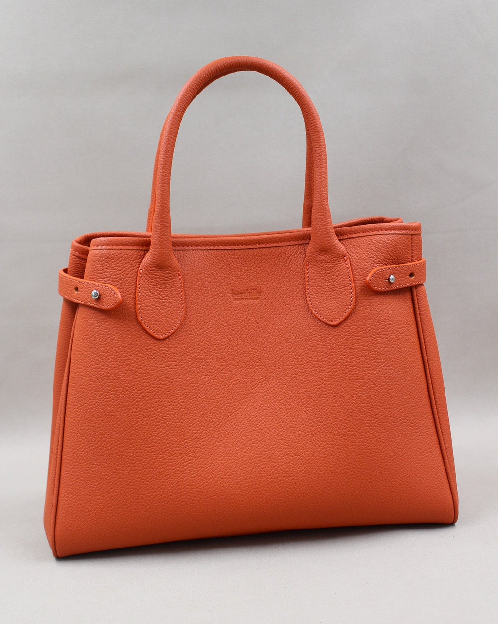 Sac Saint-Moritz cuir grainé orange butano, anses rondes et fermeture pression Berthille