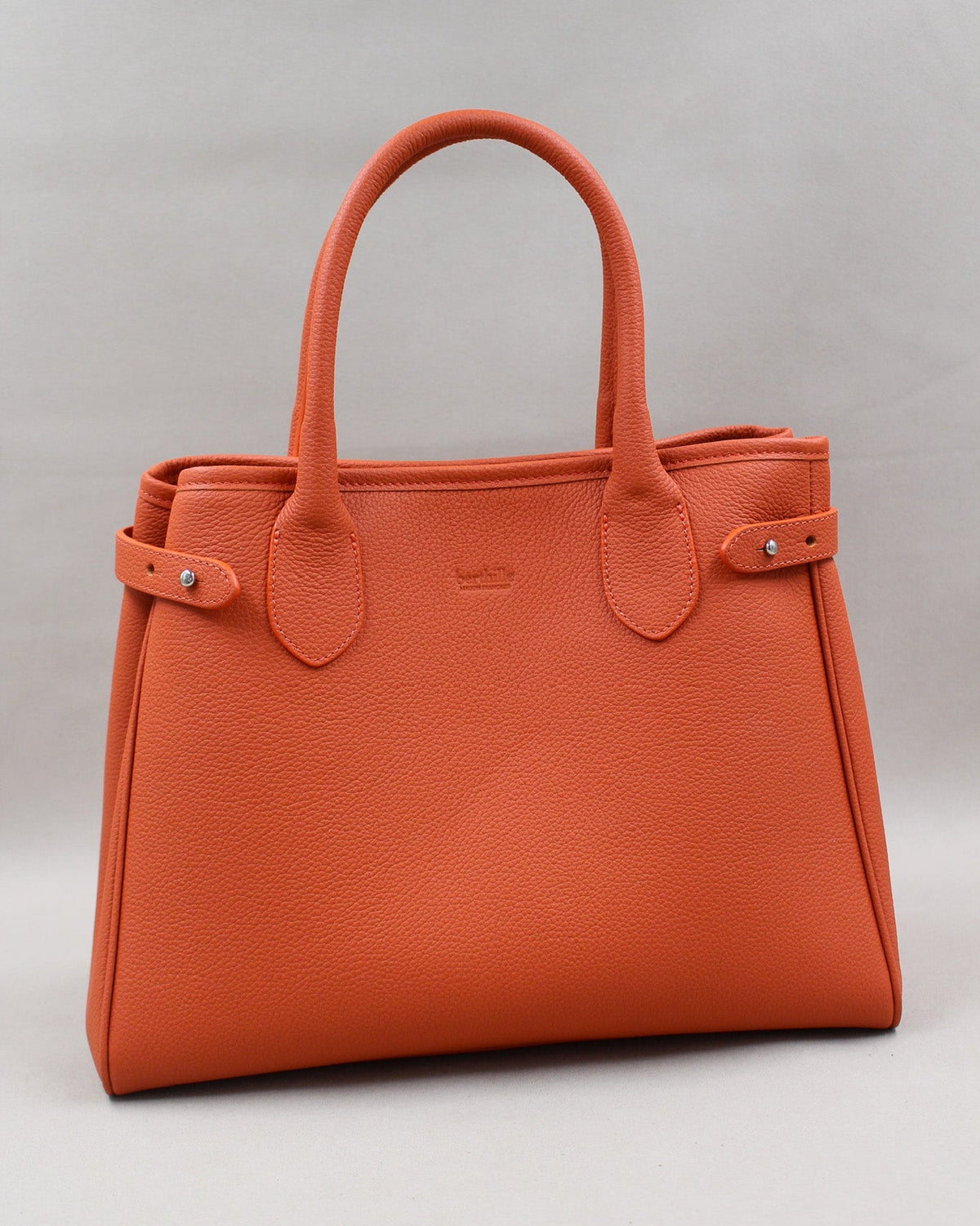Sac Saint-Moritz cuir grainé orange butano, anses rondes et fermeture pression Berthille