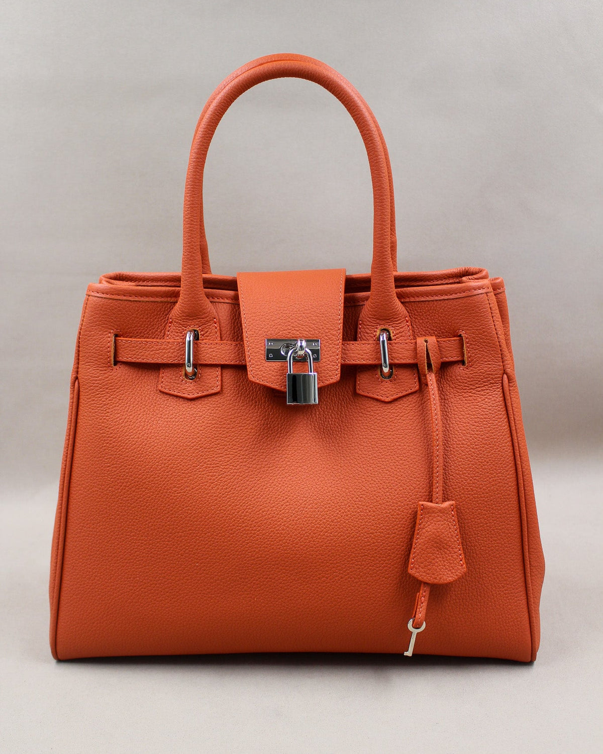 Sac Vendôme cuir grainé orange, fermoir cadenas argenté et anses rondes Berthille